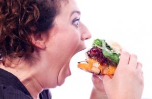 Overeating A person overeating